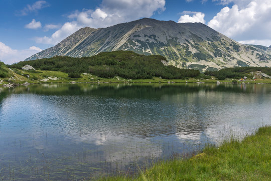 Amazing Panorama with Todorka Peak and reflection in Muratovo lake, Pirin Mountain, Bulgaria