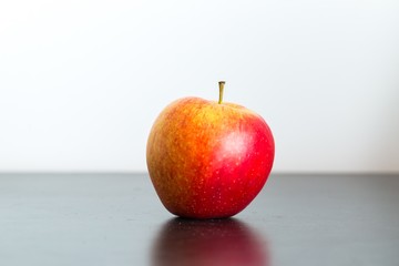 Apple lying on dark table