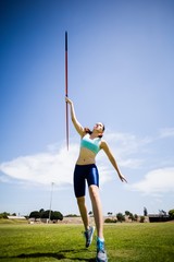 Female athlete throwing a javelin