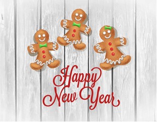 Christmas homemade gingerbread couple on wooden table