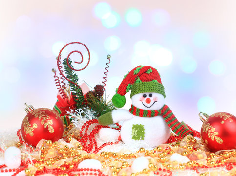 Festive snowman with Christmas light background