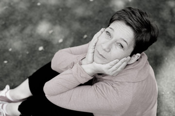 Black and white portrait of beautiful 45 years old woman outdoors