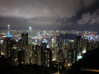 Hong Kong city skyline illuminated at night from the peak