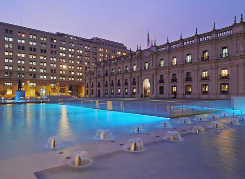 Chile, Santiago, Twilight view of La Moneda Palace from the Plaza de la Ciudadania.