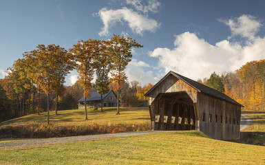 Traditional covered bridge in rural landscape, Vermont, USA