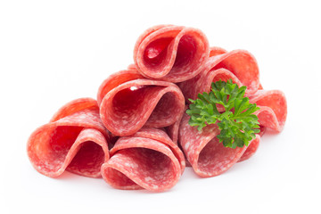 Salami sausage slices isolated on white background.