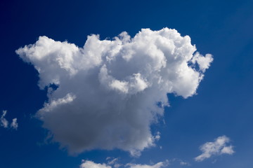 Cumulus clouds against the blue sky background