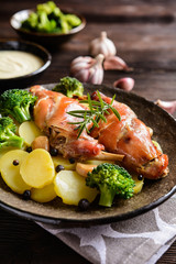 Roasted rabbit meat with potato and broccoli