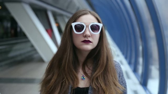 Girl with sunglasses playing and flirting