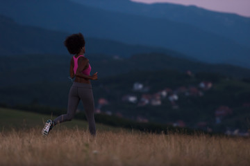 Young African american woman jogging in nature