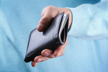 Purse with money in hand