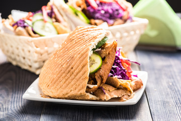 Meat with vegetables in pita bread roll