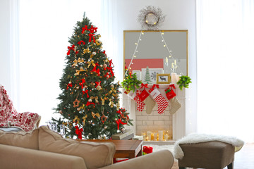 Cozy Christmas interior of living room with beautiful fir tree