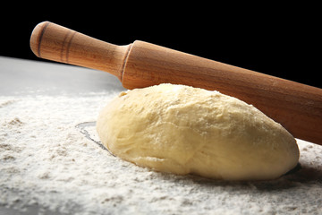 Preparation homemade pizza on kitchen table