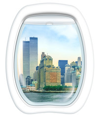 Fototapeta na wymiar Plane window on New York City with World Trade Center and Twin Towers, Manhattan, United States, from a plane through the porthole. Copy space.