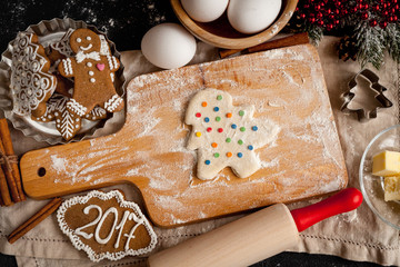 cooking christmas gingerbread on wooden background top view