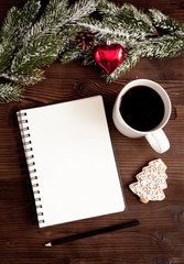 notebook and goals for new year wooden background top view