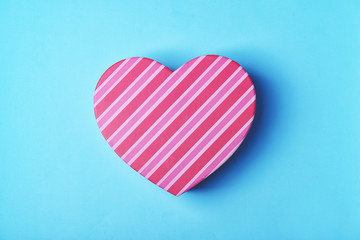 Heart shaped gift box on blue background