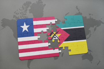 Obraz premium puzzle with the national flag of liberia and mozambique on a world map