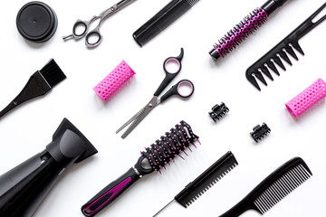 combs and hairdresser tools on white background top view