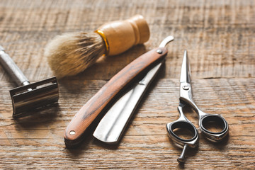 Tools for cutting beard barbershop on wooden background
