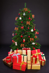 Christmas Tree with Gifts isolated on black