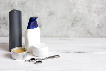 Men's cosmetics for hair care on wooden background