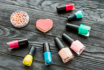 set of decorative cosmetics on wooden background top view