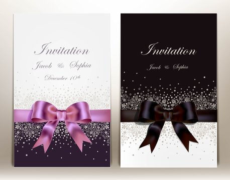 two pretty wedding invitation with ribbon and bow.