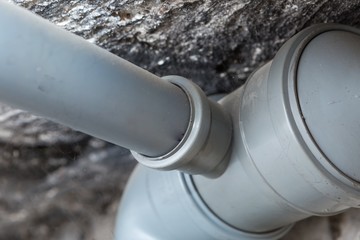 Sewer pipes in home basement - 128809989