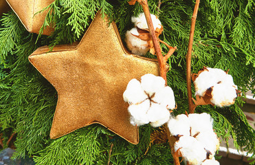 Golden star for Christmas decoration in warm tone and vintage style.