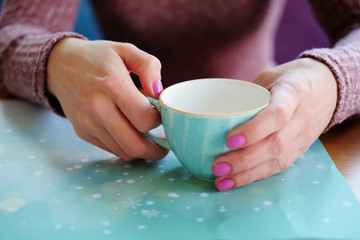 Woman drinking tea with honey