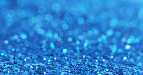 Defocused blue glitter background