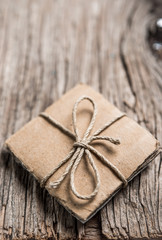 Handmade gift boxes on rustic wooden background