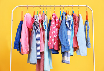 Clothes hanging on rack, closeup