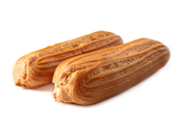 Delicious eclairs isolated on white