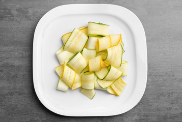 Slices of zucchini on white plate