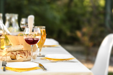 Table with food and drinks served for picnic