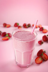 Berry milkshake on color background