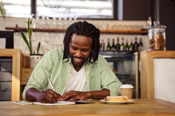 Man writing in a notebook