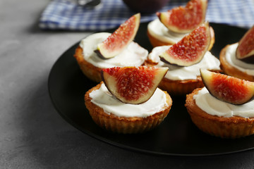 Delicious fig tarts on plate, closeup