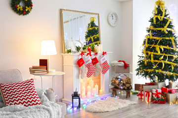 Interior of beautiful living room with fireplace decorated for Christmas