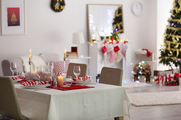 Table served for Christmas dinner in living room