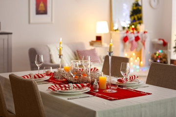Table served for Christmas dinner in living room, close up view