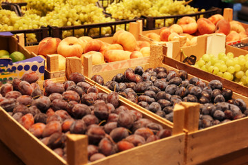 Boxes with fresh fruits in supermarket
