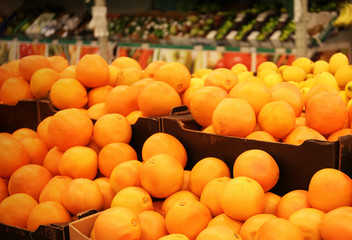 Boxes with oranges in supermarket