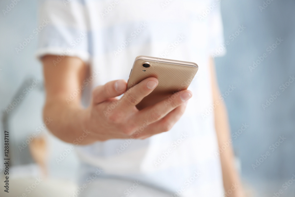 Canvas Prints Man holding smart phone, closeup