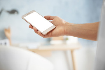 Man holding smart phone, closeup