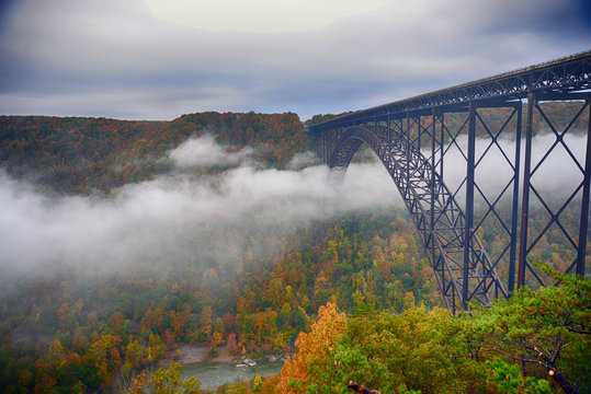 Fototapeta Fog in the morning going under the New River Gorge Bridge