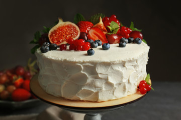 Delicious creamy cake with berries, closeup